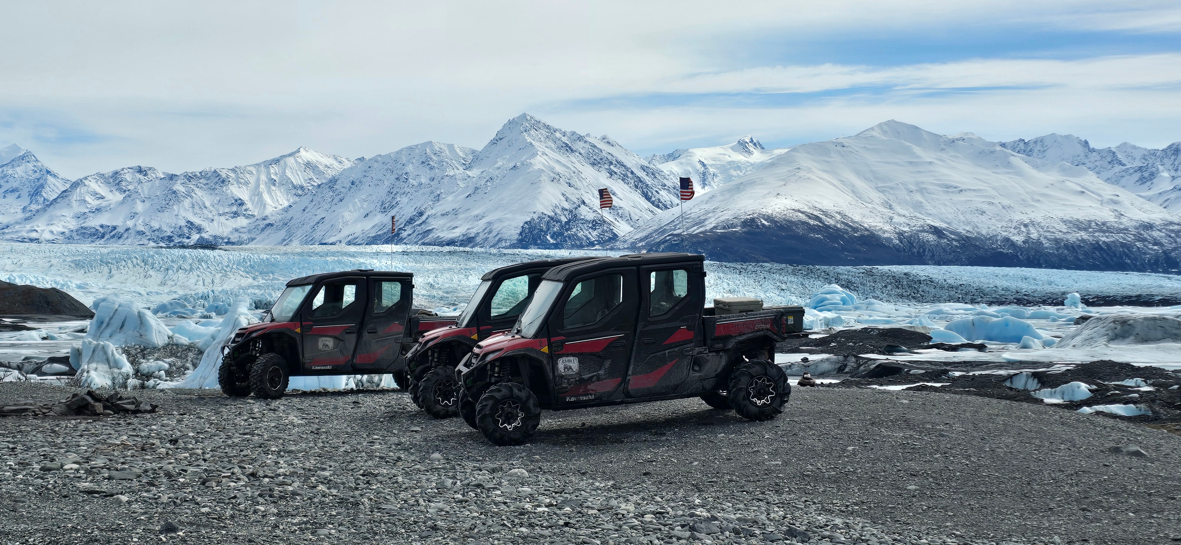 Gold Buckle Tours red trucks at glacier lagoon